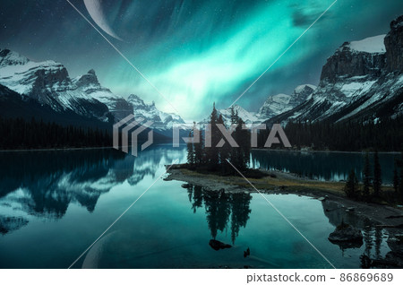 Landscape of Spirit Island with Aurora Borealis over Canadian Rockies and crescent moon on Maligne lake at Jasper national park 86869689