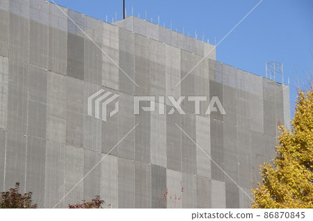 Municipal Imafukuminami Housing Building No. 4 with scaffolding and exterior wall construction under construction 86870845