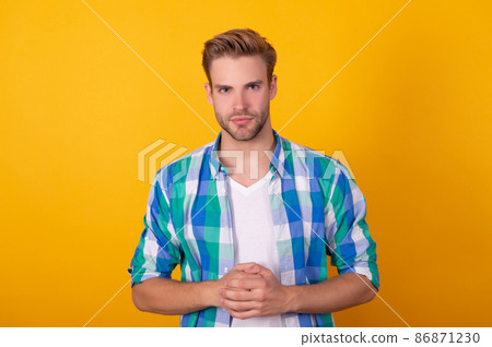 Get serious. Serious man portrait yellow background. Keeping straight face Get serious. Serious man portrait yellow background. Keeping straight face 86871230