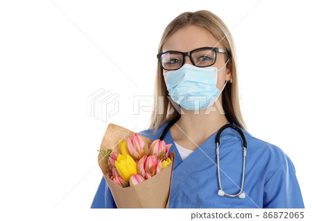 Female doctor with bouquet of flowers isolated on white background Female doctor with bouquet of flowers isolated on white background 86872065