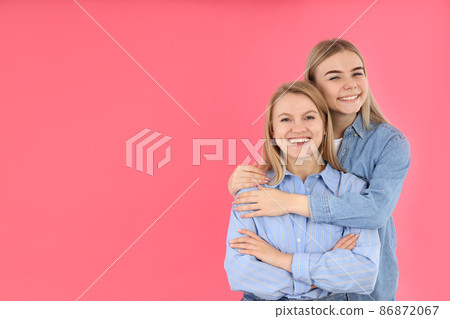 Concept of female friendship on pink background Concept of female friendship on pink background 86872067