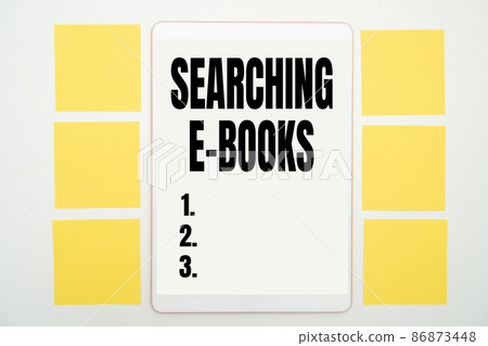 Inspiration showing sign Searching E Books. Concept meaning looking for an electronic form of educational material Office Supplies Over Desk With Keyboard And Glasses And Coffee Cup For Working 86873448