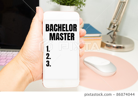 Sign displaying Bachelor Master. Business idea An advanced degree completed after bachelor s is degree Office Supplies Over Desk With Keyboard And Glasses And Coffee Cup For Working 86874044
