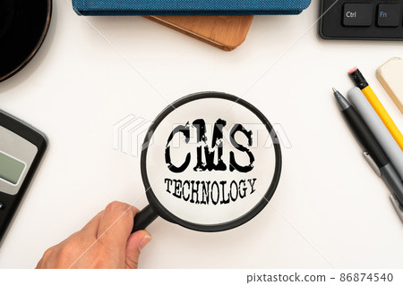 Hand writing sign Cms Technology. Business showcase programs that are used to create and manage digital content Office Supplies Over Desk With Keyboard And Glasses And Coffee Cup For Working 86874540