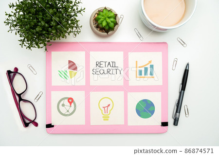 Text sign showing Retail Security. Internet Concept process which goods sold to the public in a secure fashion Office Supplies Over Desk With Keyboard And Glasses And Coffee Cup For Working 86874571