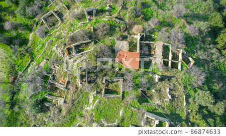 Ruins of traditional stone houses, rural depopulation in Cyprus, aerial view directly above Ruins of traditional stone houses, rural depopulation in Cyprus, aerial view directly above 86874633