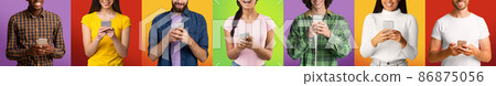 Cropped glad millennial international people in casual chatting and typing on smartphones Cropped glad millennial international people in casual chatting and typing on smartphones 86875056