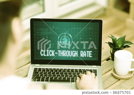 Writing displaying text Click Through Rate. Internet Concept proportion of visitors who follow link to particular site Woman Typing On Laptop Beside Coffe Mug And Plant Working From Home. 86875701