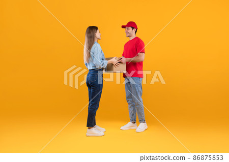 Courier Guy Giving Cardboard Parcel Boxes To Lady, Yellow Background Courier Guy Giving Cardboard Parcel Boxes To Lady, Yellow Background 86875853