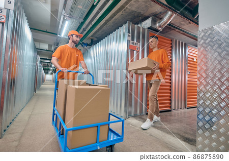 Two order pickers working together in the warehouse 86875890