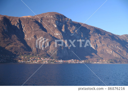 Caption of Oliveto Lario and the alps above taken from Abbadia Lariana on Como Lake 86876216