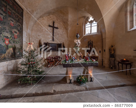 Christmas decoration, small altar with a wooden cross in the chapel of St. Anne Christmas decoration, small altar with a wooden cross in the chapel of St. Anne 86877009