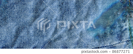 Texture of jeans textile close up. Jeans denim background 86877271