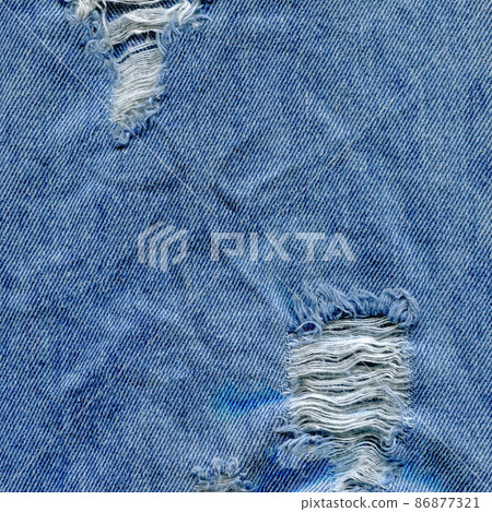 Jeans torn denim texture. Denim jeans ripped Jeans torn denim texture. Denim jeans ripped 86877321