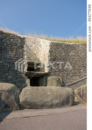 Megalith at the entrance to Newgrange, a World Heritage Site in Ireland 86877696
