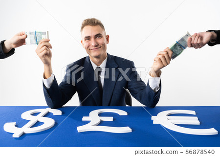 The banker is giving away money to individuals and companies that have been affected by the global crisis due to the prevailing pandemic. The banker is giving away money to individuals and companies that have been affected by the global crisis due to the prevailing pandemic. 86878540