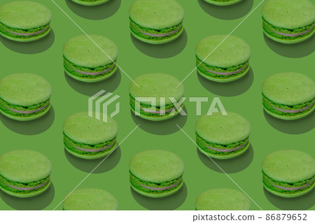 Isometric composition from traditional french macarons on green. 86879652