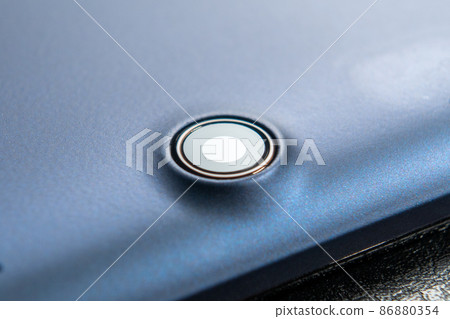 Tablet camera on the back of a mobile digital electronic device. Close-up. Copy space. Macro shot Tablet camera on the back of a mobile digital electronic device. Close-up. Copy space. Macro shot 86880354