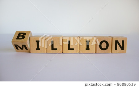Turned a cube and changed the expression 'million' to 'billion'. Beautiful white background. Copy space. Business concept. Turned a cube and changed the expression 'million' to 'billion'. Beautiful white background. Copy space. Business concept. 86880539