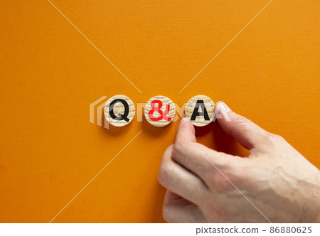 Q and A, questions and answers symbol. Concept words Q and A questions and answers on wooden circles on a beautiful orange background. Business and Q and A questions and answers concept. 86880625