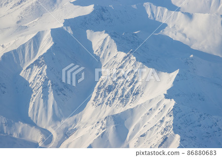 Aerial view of snow-capped mountains Aerial view of snow-capped mountains 86880683