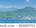 Scenic panoramic landscape view on Bay of Kotor, Montenegro with mountains at sundown. 86880703