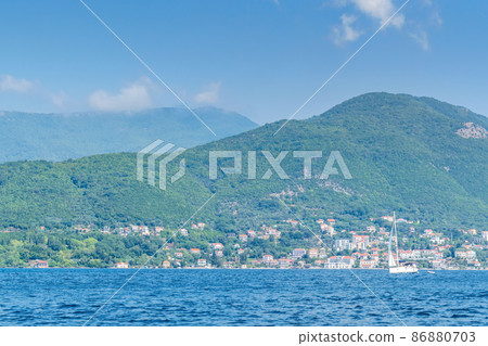 Scenic panoramic landscape view on Bay of Kotor, Montenegro with mountains at sundown. Scenic panoramic landscape view on Bay of Kotor, Montenegro with mountains at sundown. 86880703