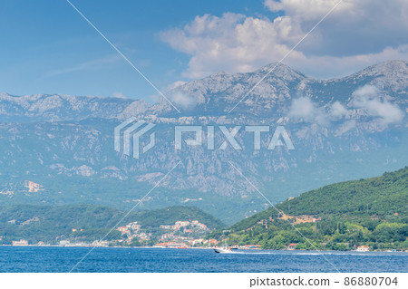 Scenic panoramic landscape view on Bay of Kotor, Montenegro with mountains at sundown. Scenic panoramic landscape view on Bay of Kotor, Montenegro with mountains at sundown. 86880704