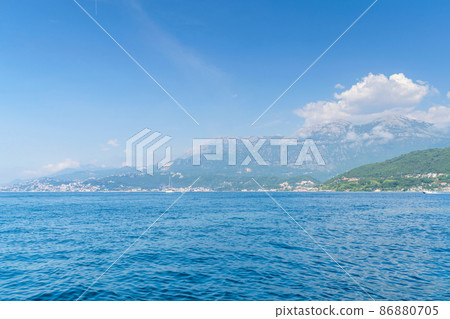 Scenic panoramic landscape view on Bay of Kotor, Montenegro with mountains at sundown. Scenic panoramic landscape view on Bay of Kotor, Montenegro with mountains at sundown. 86880705