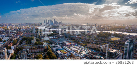 Aerial panoramic view of the Canary Wharf business district in London, UK. Financial district in London. Aerial panoramic view of the Canary Wharf business district in London, UK. Financial district in London. 86881268