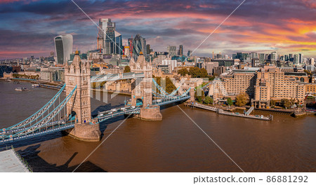 Aerial panoramic cityscape view of the London Tower Bridge and the River Thames, England, United Kingdom. Beautiful Tower bridge in London. Aerial panoramic cityscape view of the London Tower Bridge and the River Thames, England, United Kingdom. Beautiful Tower bridge in London. 86881292