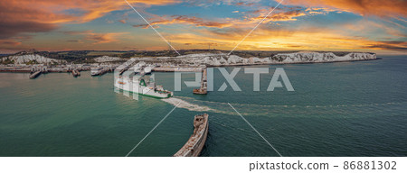 Aerial view of the Dover harbor with many ferries and cruise ships entering and exiting Dover, UK. 86881302