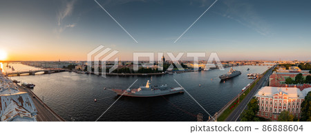 Aerial panoramic landscape of warships in the waters of the Neva River before the holiday of the Russian Navy, sea power, the latest cruisers among the sights, Isaac cathedral on a background Aerial panoramic landscape of warships in the waters of the Neva River before the holiday of the Russian Navy, sea power, the latest cruisers among the sights, Isaac cathedral on a background 86888604