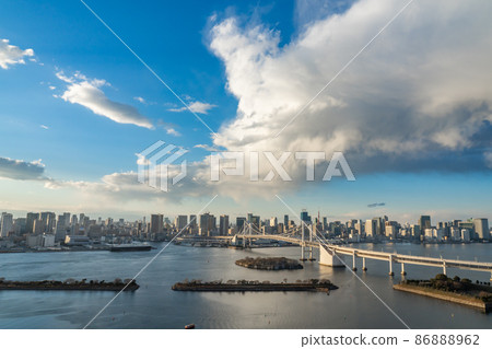 Odaiba cityscape overlooking Tokyo Tower and Rainbow Bridge Odaiba cityscape overlooking Tokyo Tower and Rainbow Bridge 86888962