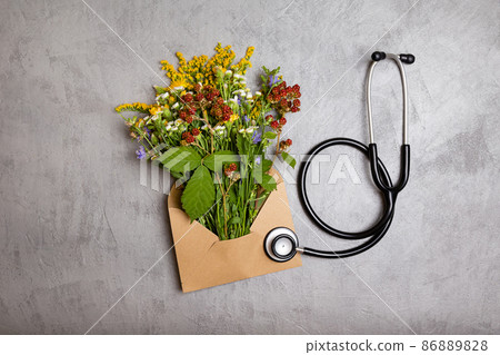 Healing herbs on concrete table, herbal medicine, top view. 86889828