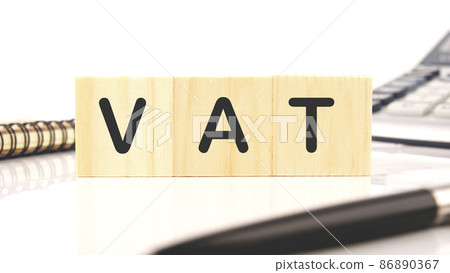 Vat on wooden cubes over white background, financial concept background 86890367