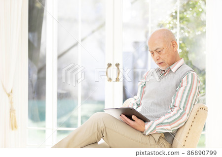 Senior man enjoying nesting and home time 86890799