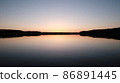Water surface of the Lake and vegetation during sunset. 86891445
