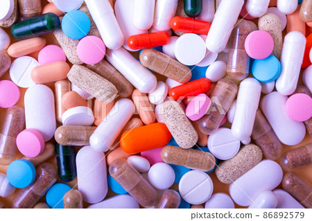 Medicine pills and capsules background. Top view. 86892579