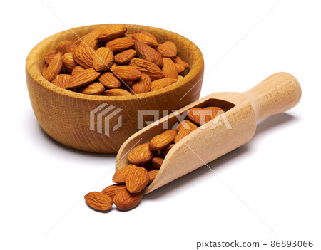 Wooden Scoop and bowl full of Almond nuts isolated on a white background 86893066