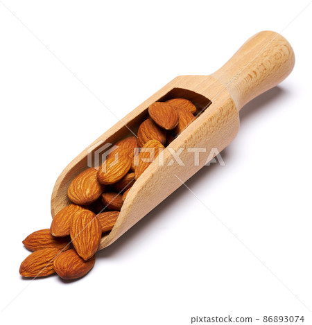 Wooden Scoop full of Almond nuts isolated on a white background 86893074