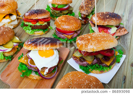 Set of burgers made with various fillings 86893098