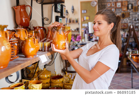 Girl visiting souvenir shop Girl visiting souvenir shop 86893185