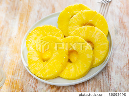 Beautifully laid out canned pineapple on a plate Beautifully laid out canned pineapple on a plate 86893698