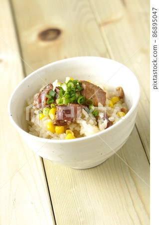 Cooked rice using yakitori and corn Cooked rice using yakitori and corn 86895047