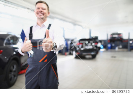 Happy worker in uniform show thumbs up, well done service job 86895725