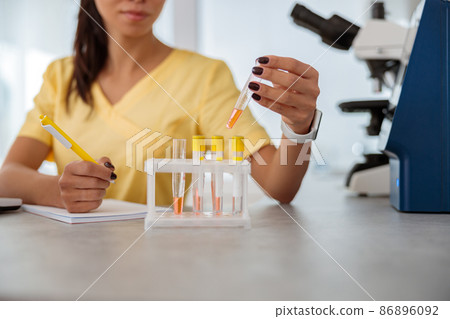 Female veterinarian conducting medical researches in animal clinic Female veterinarian conducting medical researches in animal clinic 86896092