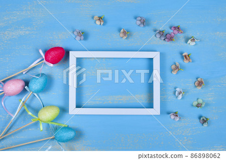White frame, Easter eggs, flowers and rabbit ears 86898062