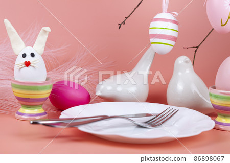 Easter table setting and dinner with  festive decorations 86898067