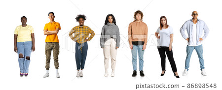 Group of different, multi ethnic people, men and women standing isolated over white background, Horizontal flyer, banner. Models in casual clothes Group of different, multi ethnic people, men and women standing isolated over white background, Horizontal flyer, banner. Models in casual clothes 86898548